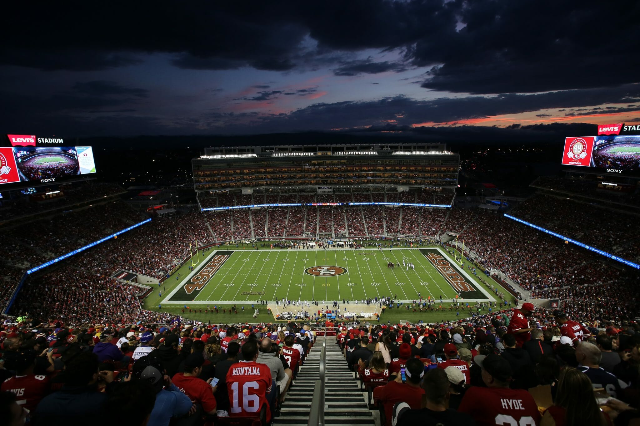 A packed Levi&rsquo;s Stadium at sunset during a 49ers game