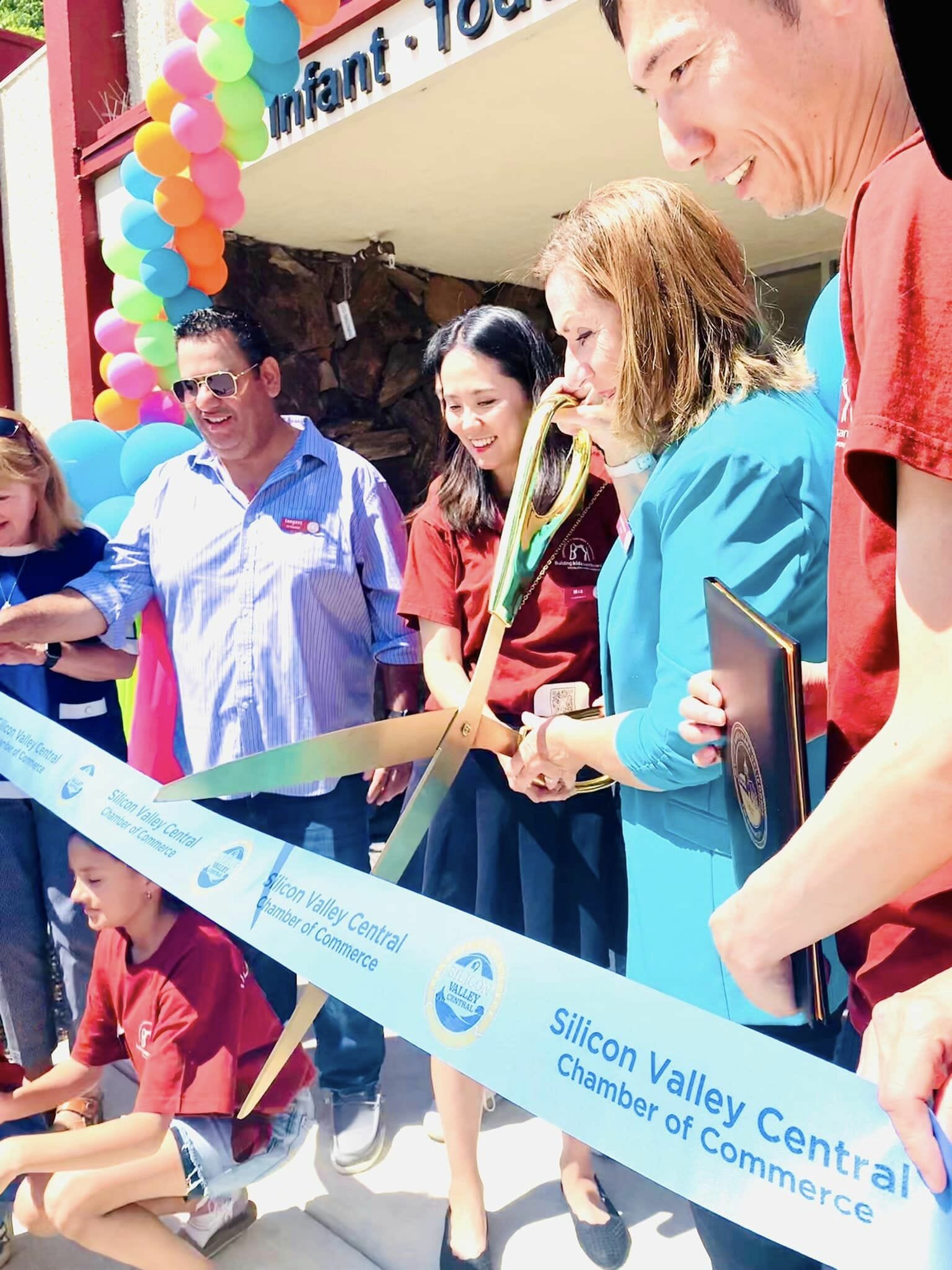 Close-up of the ceremonial scissors cutting the ribbon