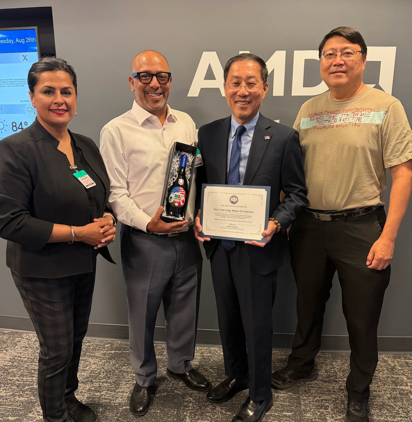 Chamber CEO Harbir Kaur Bhatia presenting a Certificate of Recognition to Mayor Fred Jung at AMD